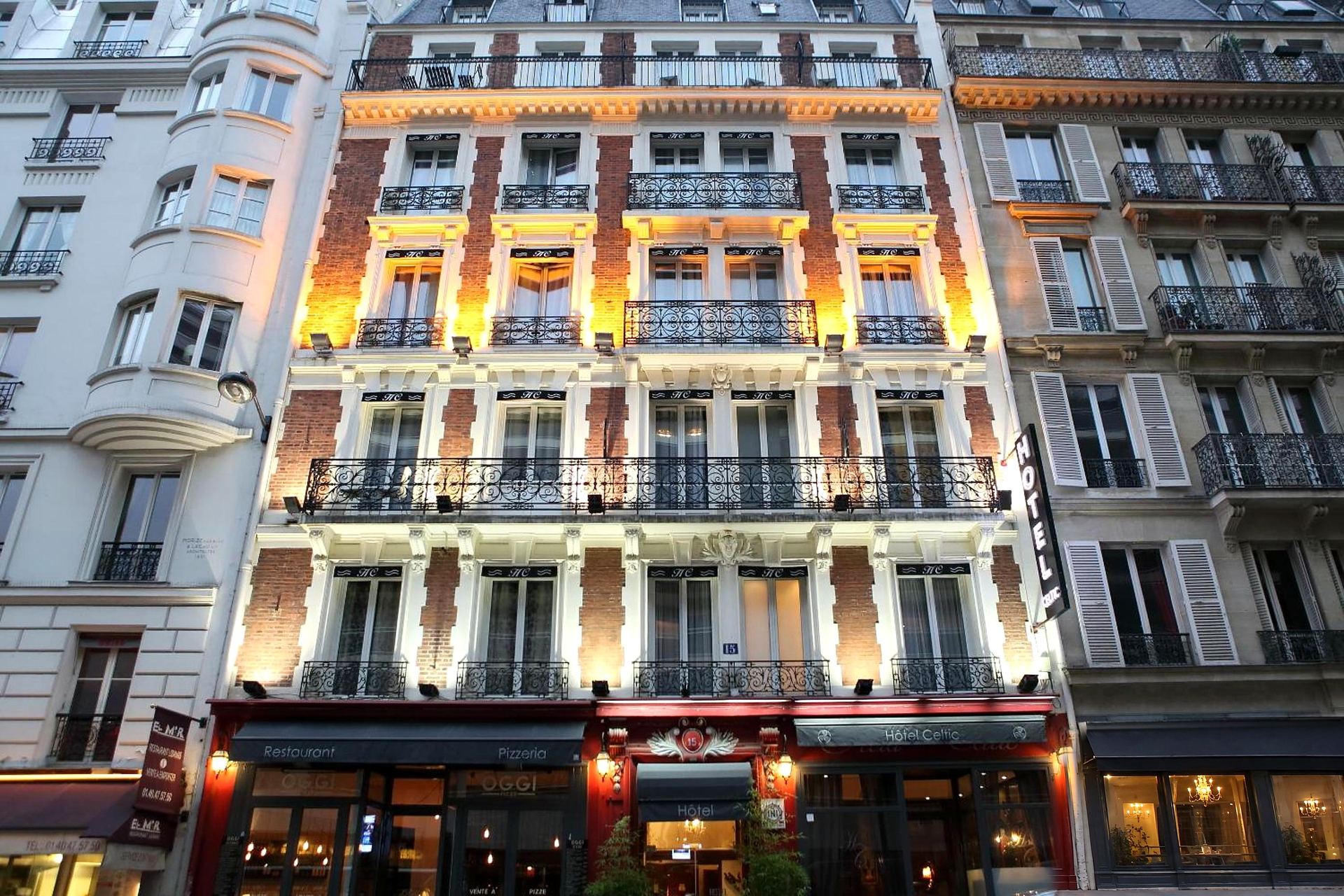 The façade of Hôtel Celtic at dusk, rue d’Odessa